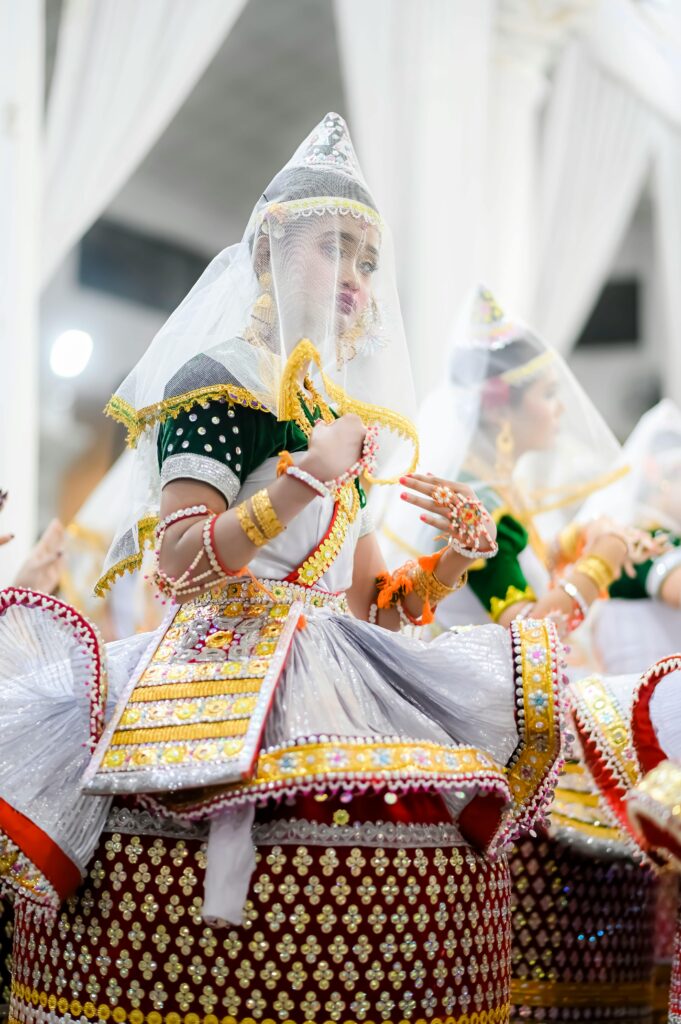 Vibrant Manipuri dancers in traditional attire perform a cultural dance at a festival in Imphal, India.
“5 Indian Classical Dances