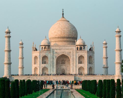 A stunning shot of the Taj Mahal in Agra, showcasing its iconic architecture and serene surroundings.